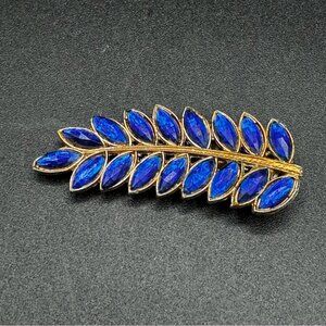Vintage Signed Sapphire Blue Rhinestone and Gold Tone Leaf Dress Clip